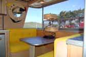 Dining area in front of 1960 vintage Holiday House trailer