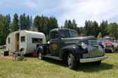 Vintage 1946 chevy pickup truck towing a vintage travel trailer