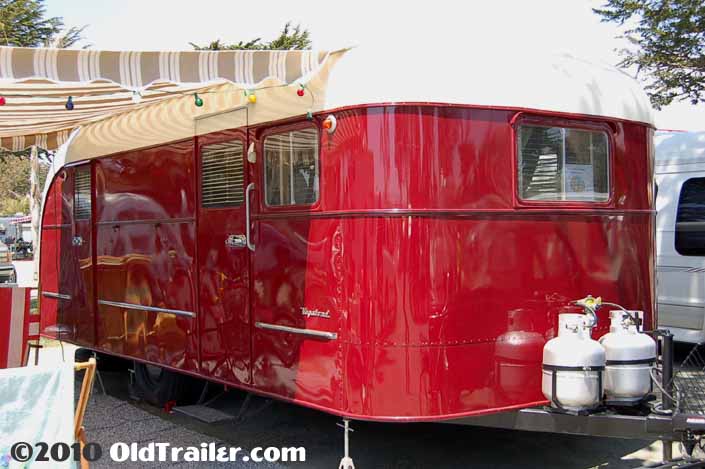 Photo of a vintage 1949 Vagabond trailer with red and cream paint job