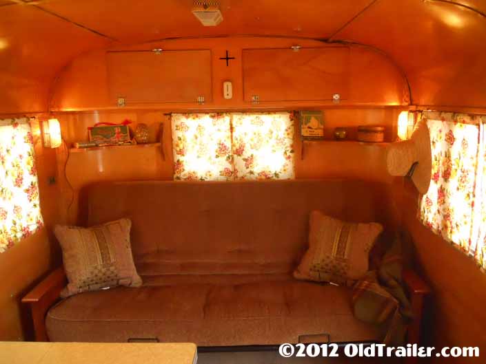This restored 1950 Vagabond trailer has a warmly inviting living room