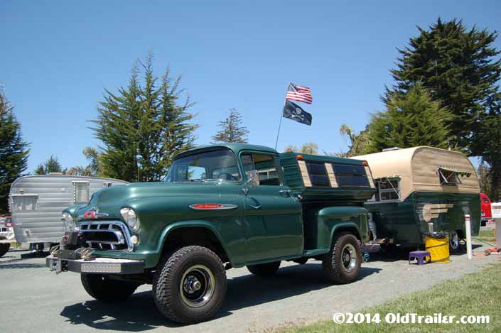 This vintage towing rig is a chevy stepside pickup truck pulling a vintage 1955 Aljoa trailer