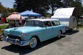 Picture of a vintage 1955 chevy nomad wagon towing a vintage teardrop trailer