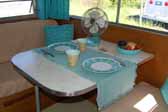 Very nicely decorated dining area in a fully restored Aladdin vintage trailer