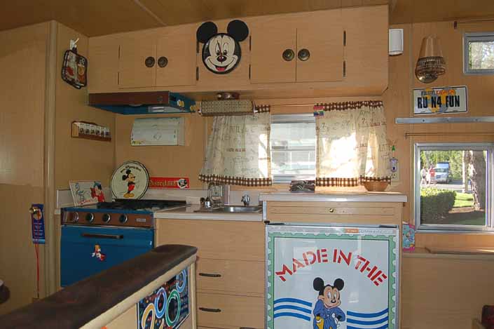 Fun Mickey Mouse and Disney decorations in the Kitchen of an Aladdin Vintage Trailer