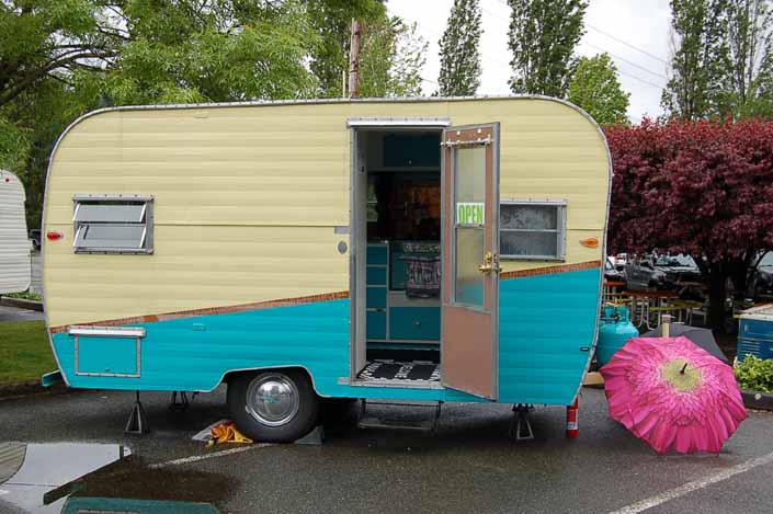 Image shows the side of an Aladdin Vintage Trailer at the XXX Root Beer Issaquah Trailer Rally in Washington State