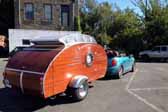 Picture of a mini cooper convertible towing an awesome custom teardrop trailer
