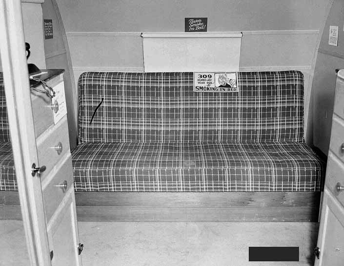 Government photo shows the plaid couch in a 1940's Government Model Trailer, at the Hanford Trailer Camp