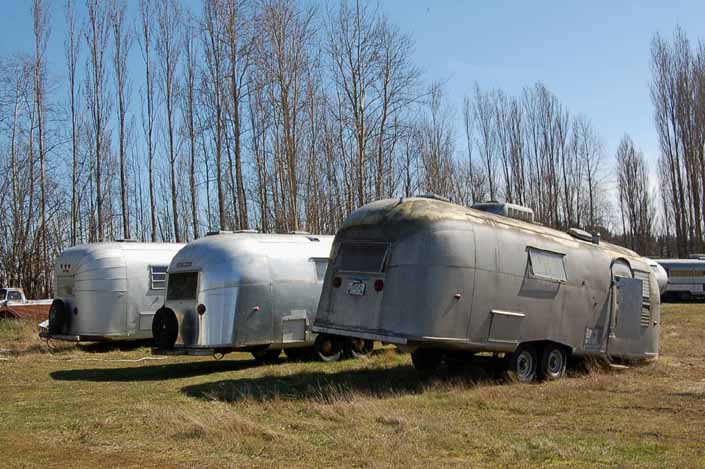 This vintage trailer junk yard has a group of vintage Airstream trailers available for restoration