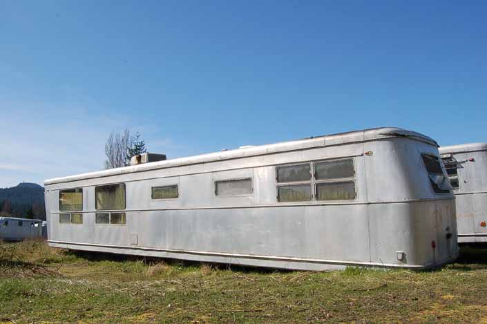 Vintage trailer junk yard has several large vintage Spartan trailer in storage