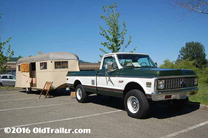 This vintage towing rig is a Chevy 4x4 pickup truck pulling a Vintage Vagabond Trailer