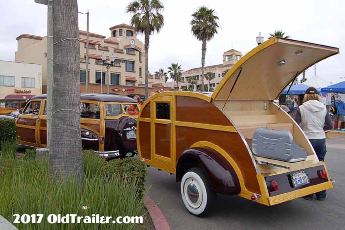 This vintage towing rig is a 1950 plymouth woodie wagon pulling a woodie teardrop trailer