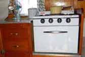 Early 1954 Shasta 1400 Travel Trailer with original gas stove and birch kitchen cabinets