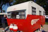 Photo of gorgeous red and white 1955 vintage Aljoa travel trailer