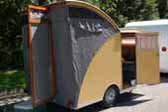 1956 CampMaster Teardrop trailer with wood sidea and canvas rear pop-top
