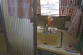 Photo of bathroom shower and lavatory sink in a 1961 Holiday House vintage trailer - 24ft model