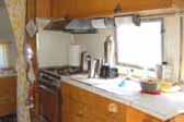 Comfortable bathroom off kitchen area in 1963 Airstream Flying Cloud trailer