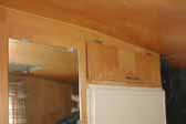 Original birch cabinets and plywood paneling in 1963 Shasta Trailer