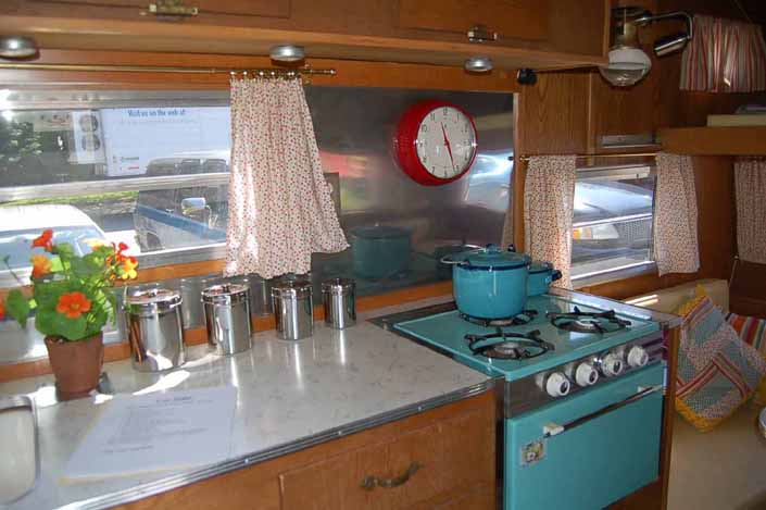 Very cozy and welcoming interior decorations and accessories in a beautifully restored vintage Aladdin Genie travel trailer