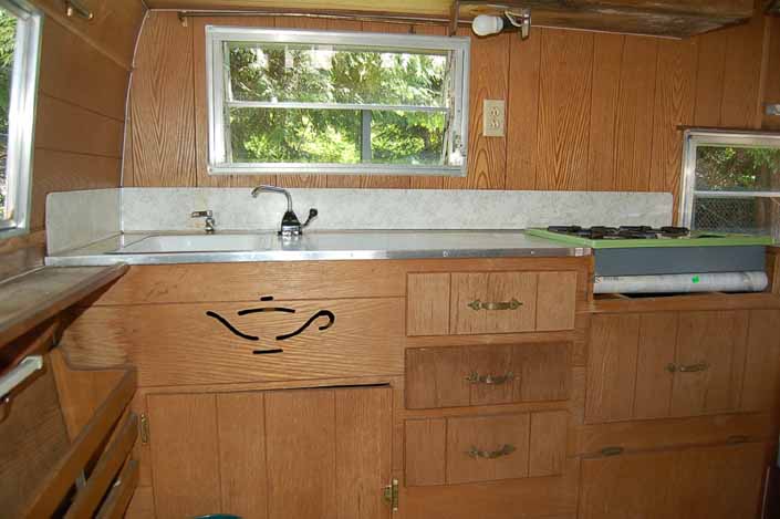 Photo shows a classic Aladdin Genie travel trailer with a great interior in original condition with Aladdin's Lamp cut-out from the factory