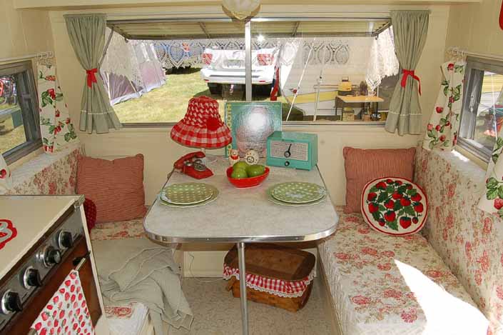 Beautifully restored and decorated dining area in a vintage Aladdin Travel Trailer