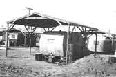 Government photo shows the worker's 1940's trailers under shade covers, at the Project Hanford Trailer City in Washington