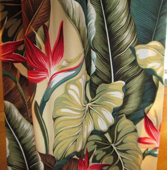 This photo shows a swatch of retro fabric with a beautiful hawaiian tropical flowers pattern, for your vintage trailer