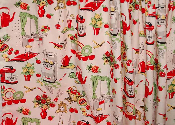 This photo shows a swatch of retro fabric with a happy kitchen appliances illustrations pattern, for your vintage trailer