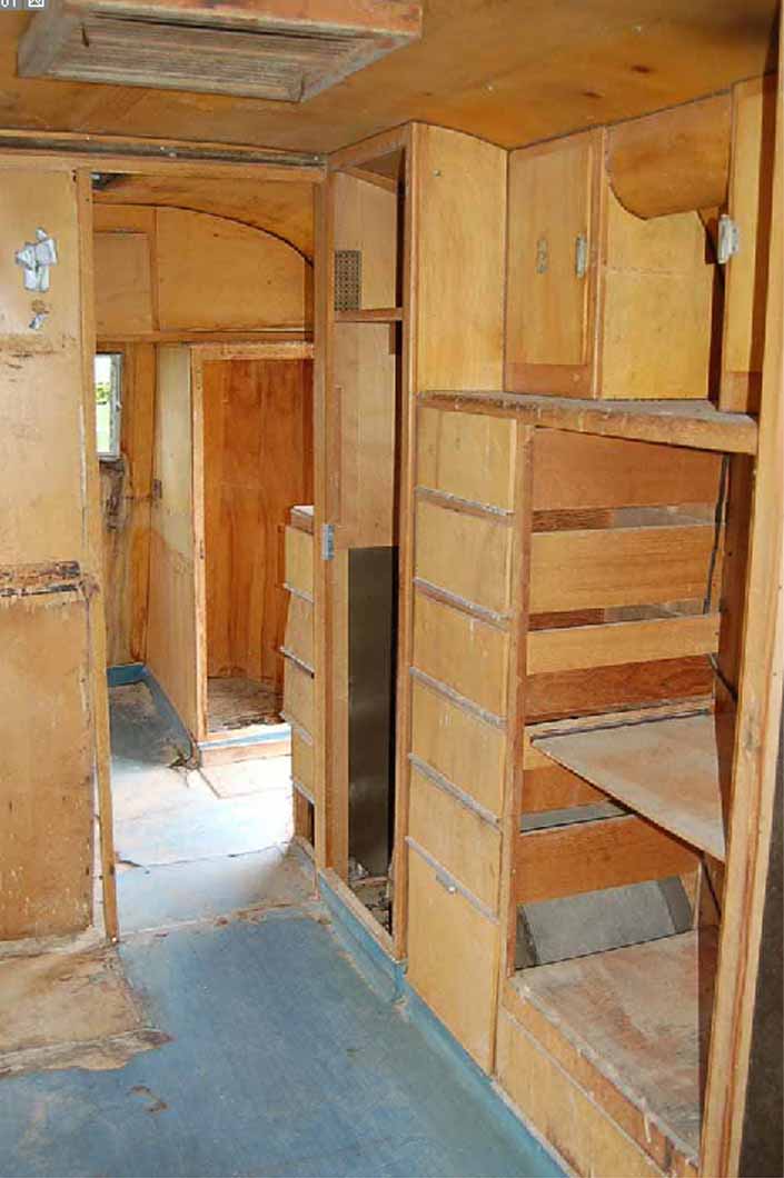 Worn but restorable interior woodwork in a 1947 Westcraft vintage trailer for sale at Pismo Trailer Rally