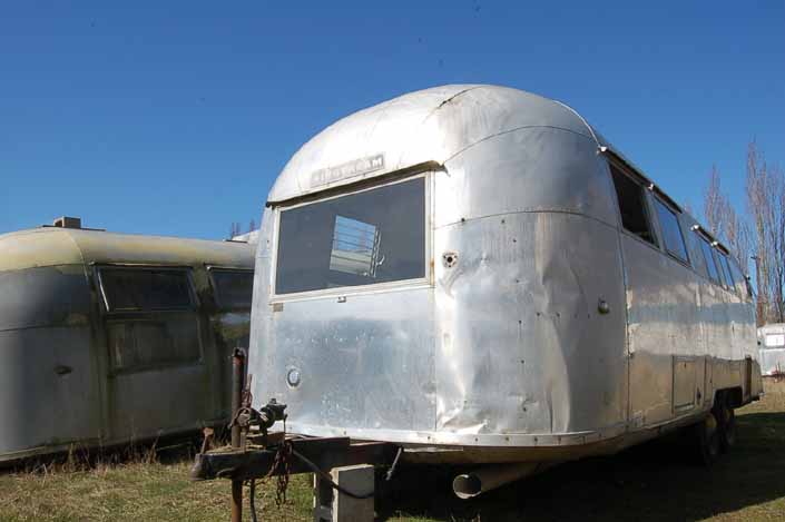 Vintage trailer junkyard has a vintage Airstream travel trailer ready for restoration