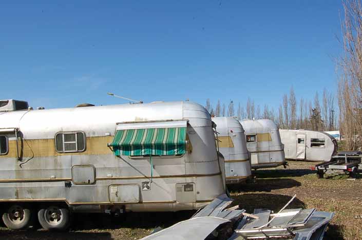 Vintage trailer junkyard has a group of Silver Streak and Spartanette trailers available for restoration
