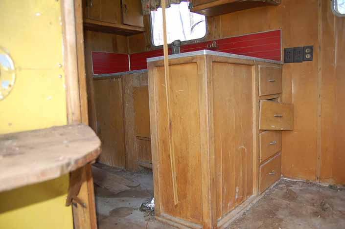 Palace vintage trailer found in a vintage trailer Storage Yard that still has its original flooring and kitchen cabinet work